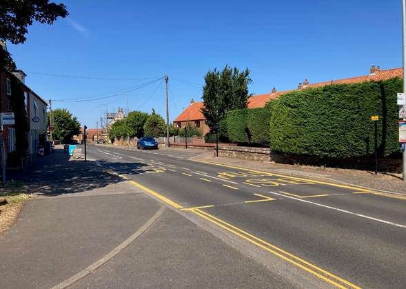 road with a bus stop on each side